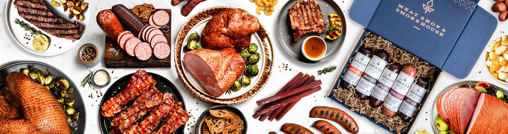 table full of Amana Meat Shop food on plates