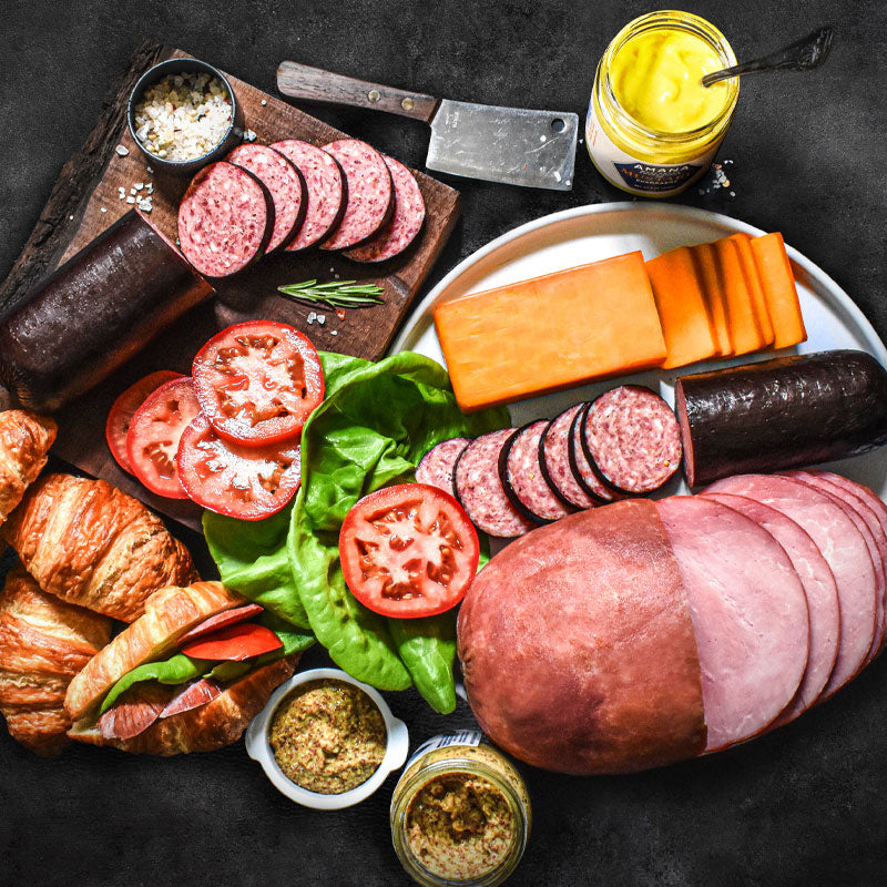 ultimate sandwich kit presented on a plate and cutting board