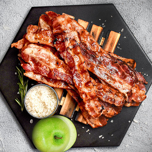 stack of smoked applewood bacon on serving plate