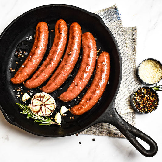 andouille bratwurst in a skillet