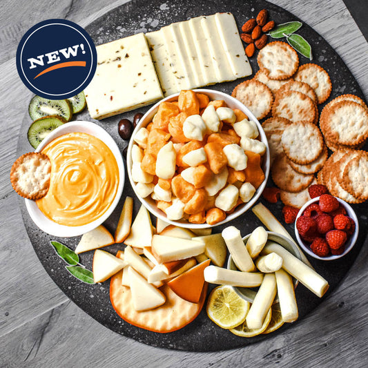 cheese and crackers combo laid out on serving tray