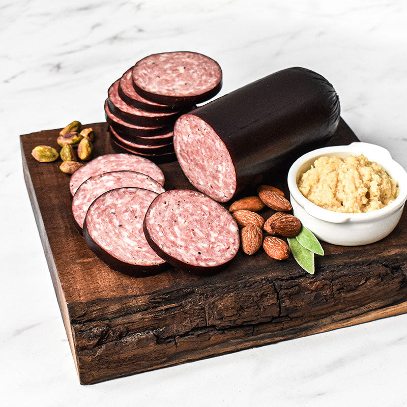 double smoked summer sausage on a wooden cutting board