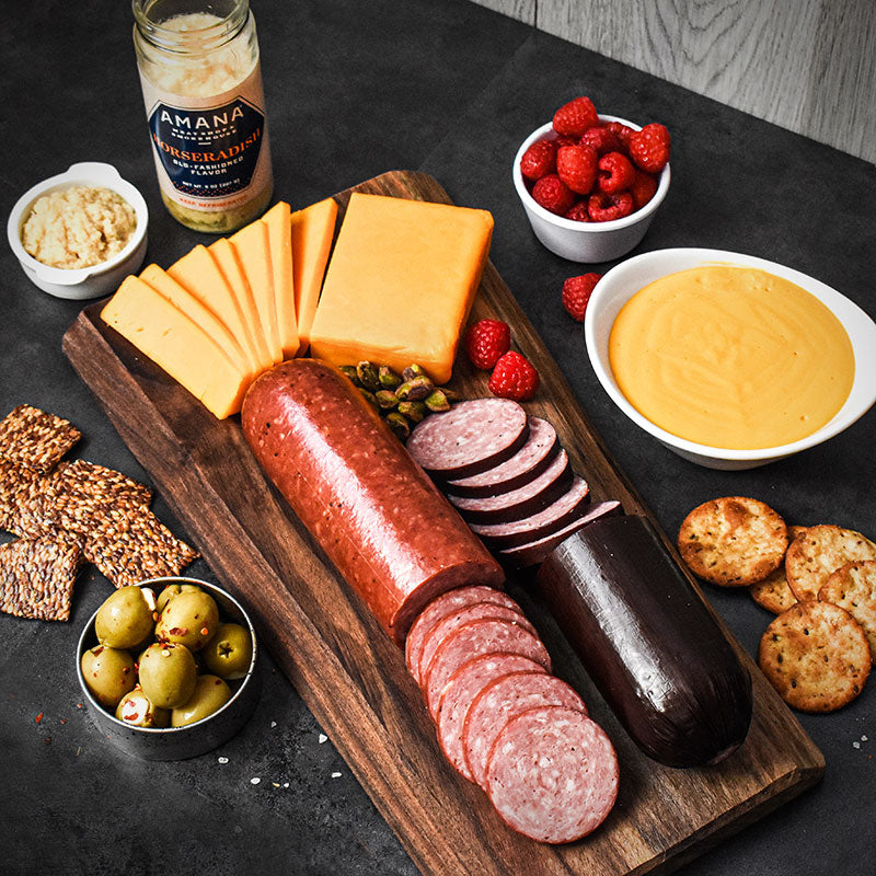 dutch lunch items laid out on wooden cutting board