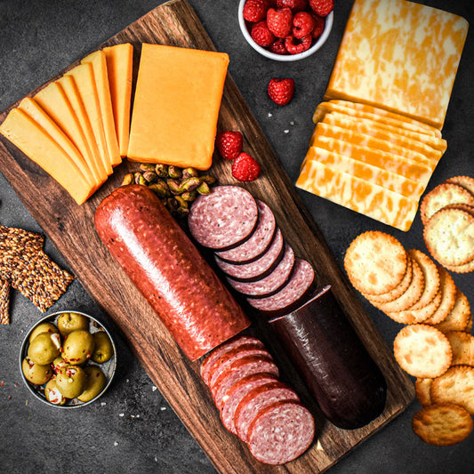 dutch lunch items laid out on wooden cutting board