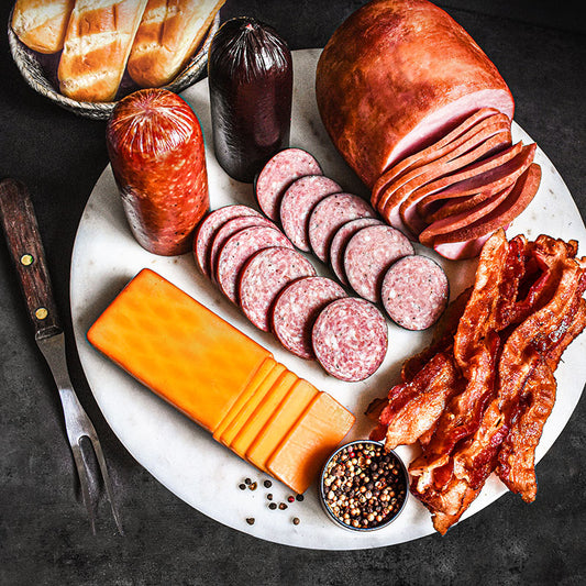 pride of smokehouse items partially sliced on marble tray