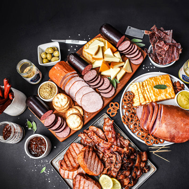 smokehouse bounty items displayed on different servings trays with various sides