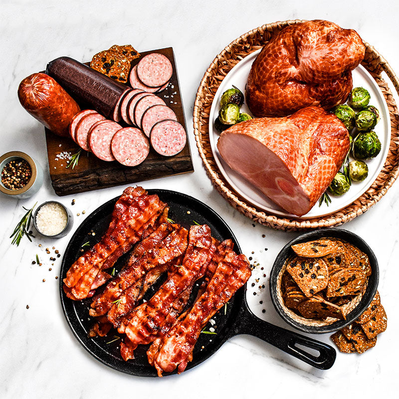 smokehouse supreme items arranged on plates cutting boards and skillets