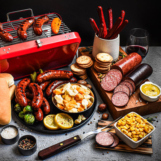 tailgater bundle displayed on a plate, grill, and cutting board