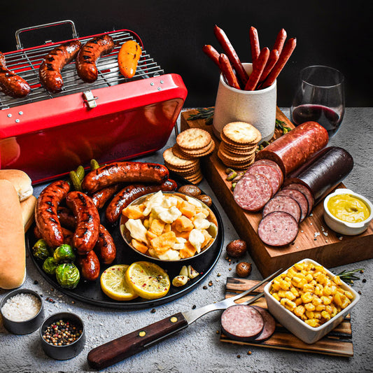 tailgater bundle displayed on a plate, grill, and cutting board